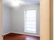 Bedroom with a window, hardwood floors, and white walls at 679 Winchester Ln, Norcross, GA 30071