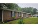 Charming home with brick facade and a well-maintained lawn at 679 Winchester Ln, Norcross, GA 30071