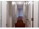 Hallway with doors and white walls leading to other rooms of the home at 679 Winchester Ln, Norcross, GA 30071