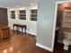 Basement bathroom with a toilet, sink, and storage, located by three large windows at 1305 Lake Forest Ln, Mcdonough, GA 30253