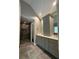 Bathroom showcasing a double vanity, gray cabinetry, luxurious shower, and neutral color palette at 1305 Lake Forest Ln, Mcdonough, GA 30253