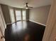 Spacious bedroom with dark hardwood floors, natural light, and neutral paint at 1305 Lake Forest Ln, Mcdonough, GA 30253