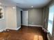 Bonus room with large window, unfinished floors, and natural light perfect for office at 1305 Lake Forest Ln, Mcdonough, GA 30253