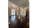 Dining room with dark wood floors, white trim, and a window with decorative stained glass at 1305 Lake Forest Ln, Mcdonough, GA 30253
