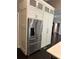 Modern kitchen featuring stainless steel refrigerator and white cabinets at 1305 Lake Forest Ln, Mcdonough, GA 30253