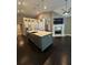Open kitchen with large island, stainless steel appliances, and modern finishes at 1305 Lake Forest Ln, Mcdonough, GA 30253