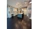 Gourmet kitchen with custom cabinetry, an island, desk, and modern appliances, perfect for entertaining at 1305 Lake Forest Ln, Mcdonough, GA 30253