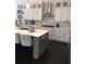 Spacious kitchen with marble counters, stainless steel hood, and custom cabinets at 1305 Lake Forest Ln, Mcdonough, GA 30253