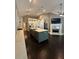 Modern kitchen with island, stainless appliances, and an open layout to living area at 1305 Lake Forest Ln, Mcdonough, GA 30253
