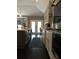 Gourmet kitchen boasts a large island, stainless appliances, and dark hardwood floors at 1305 Lake Forest Ln, Mcdonough, GA 30253