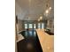 Modern kitchen features hardwood floors, pendant lights, and countertops at 1305 Lake Forest Ln, Mcdonough, GA 30253