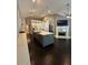 Open kitchen with large island, stainless steel appliances, and modern finishes at 1305 Lake Forest Ln, Mcdonough, GA 30253