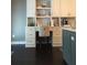Custom kitchen includes built-in desk with storage, stylish backsplash, and plenty of counter space at 1305 Lake Forest Ln, Mcdonough, GA 30253