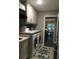 Laundry room with cabinets, a sink, and washer and dryer; door leads to the kitchen at 1305 Lake Forest Ln, Mcdonough, GA 30253