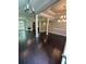 Open concept living room with hardwood floors, fireplace, and natural light at 1305 Lake Forest Ln, Mcdonough, GA 30253