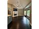 Living area with high ceilings, fireplace, large windows, and easy access to kitchen at 1305 Lake Forest Ln, Mcdonough, GA 30253