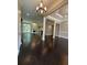 Bright living room showcasing an open layout, fireplace, and gleaming hardwood floors at 1305 Lake Forest Ln, Mcdonough, GA 30253