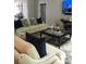 Cozy living room with a comfortable sofa and stylish decor at 1305 Lake Forest Ln, Mcdonough, GA 30253