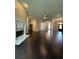 Spacious living room featuring hardwood floors and an elegant fireplace at 1305 Lake Forest Ln, Mcdonough, GA 30253