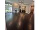 Spacious living area with fireplace, large windows, and seamless flow into the modern kitchen at 1305 Lake Forest Ln, Mcdonough, GA 30253