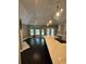 Open-concept living area boasts hardwood floors, fireplace, ceiling fan, and seamless connection to kitchen at 1305 Lake Forest Ln, Mcdonough, GA 30253