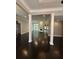 Spacious living area features hardwood floors, columns, and abundant natural light from large windows at 1305 Lake Forest Ln, Mcdonough, GA 30253