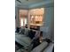 Comfortable living room connected to the kitchen, perfect for relaxing and entertaining guests in style at 1305 Lake Forest Ln, Mcdonough, GA 30253
