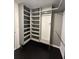 A walk-in closet is shown, featuring built-in shelving and ample storage space at 1305 Lake Forest Ln, Mcdonough, GA 30253