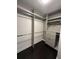 Spacious walk-in closet features ample hanging space and built-in storage at 1305 Lake Forest Ln, Mcdonough, GA 30253