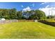 Expansive backyard with lush green lawn and wood fence at 1480 Shady Cove Ln, Lawrenceville, GA 30043