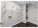Basement with shelving, water heater, and visible hookups at 1480 Shady Cove Ln, Lawrenceville, GA 30043