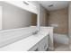 Modern bathroom with white vanity, bathtub, and marble-style tile at 1480 Shady Cove Ln, Lawrenceville, GA 30043