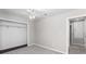 Bright bedroom featuring a ceiling fan, neutral paint and trim, and a walk-in closet at 1480 Shady Cove Ln, Lawrenceville, GA 30043