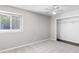 Bright bedroom featuring a ceiling fan, neutral paint and trim, and a walk-in closet at 1480 Shady Cove Ln, Lawrenceville, GA 30043