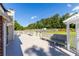 Spacious outdoor deck featuring benches, pergola and view of the fenced backyard at 1480 Shady Cove Ln, Lawrenceville, GA 30043