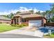 The exterior features well-maintained landscaping and a two-car garage at 1480 Shady Cove Ln, Lawrenceville, GA 30043