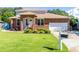 Charming brick home with well-manicured lawn and an attached two-car garage at 1480 Shady Cove Ln, Lawrenceville, GA 30043