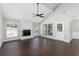 Spacious living room features a brick fireplace, high ceilings, and dark wood flooring at 1480 Shady Cove Ln, Lawrenceville, GA 30043