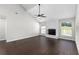 Spacious living room with vaulted ceilings, fireplace, wood floors, and natural light at 1480 Shady Cove Ln, Lawrenceville, GA 30043