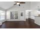 Bright and airy living room features dark wood floors and a view to the outdoors at 1480 Shady Cove Ln, Lawrenceville, GA 30043