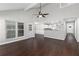 Open-concept living room showcases dark wood floors and a view to the modern kitchen at 1480 Shady Cove Ln, Lawrenceville, GA 30043