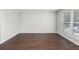 Inviting living room with hardwood floors and a large window providing natural light at 1480 Shady Cove Ln, Lawrenceville, GA 30043