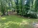 Spacious backyard with lush green grass and a wooded perimeter at 1599 Sandtown Rd, Atlanta, GA 30311