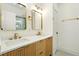 Bathroom with double vanity, quartz countertop, modern gold fixtures, and a well lit shower at 1599 Sandtown Rd, Atlanta, GA 30311