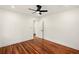 Bright bedroom showcasing hardwood floors, ceiling fan, and access to a bathroom, ideal for relaxation at 1599 Sandtown Rd, Atlanta, GA 30311