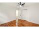Bright bedroom with hardwood floors, ceiling fan, and double-door closet at 1599 Sandtown Rd, Atlanta, GA 30311