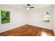 Bright bedroom with hardwood floors, featuring large windows, ceiling fan, and filled with natural light at 1599 Sandtown Rd, Atlanta, GA 30311