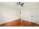 Spacious bedroom features hardwood floors, ceiling fan, and a neutral palette for a cozy atmosphere at 1599 Sandtown Rd, Atlanta, GA 30311
