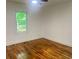 Bright bedroom with hardwood floors, a ceiling fan and a view of the outdoors at 1599 Sandtown Rd, Atlanta, GA 30311