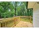 Wood deck with railing overlooking a beautiful, lush, green backyard at 1599 Sandtown Rd, Atlanta, GA 30311